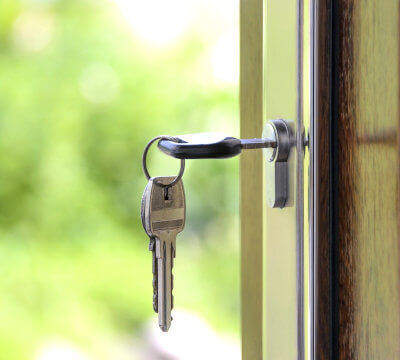 photo of a part of an open door with keys which symbolizes our Meet & Greet service