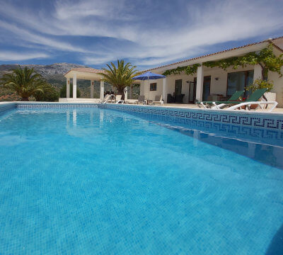 Photo of a pool of house in Sedella in the Axarquia for our professional pool services with mountain Maroma in the background