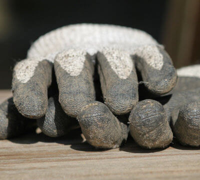 Photo of used gloves as symbol for work on house and garden